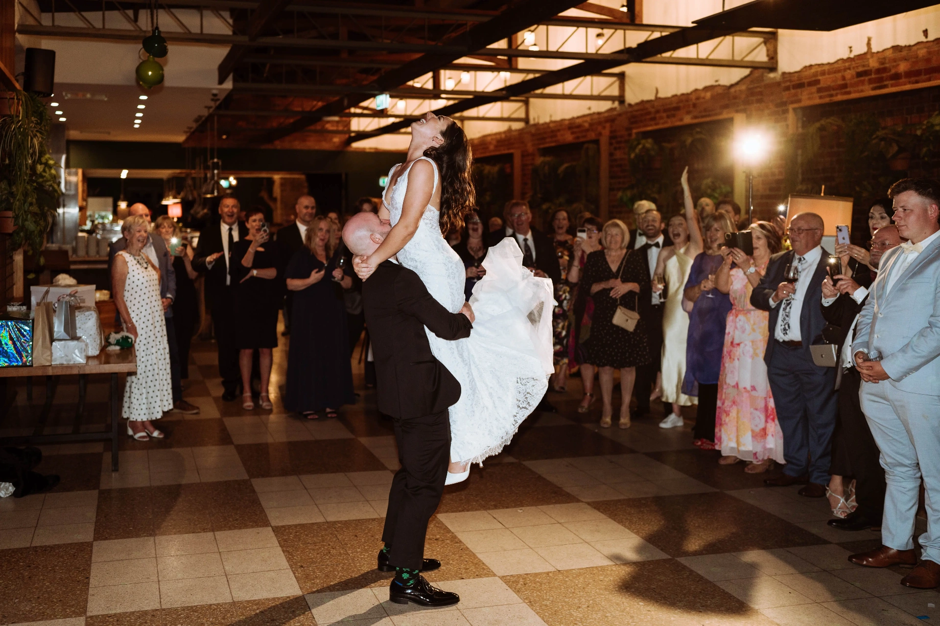Bride lifted on the dance floor